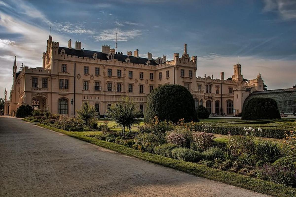 a large building with a garden in front of it