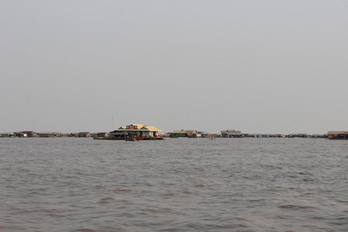 a view of a large body of water with houses