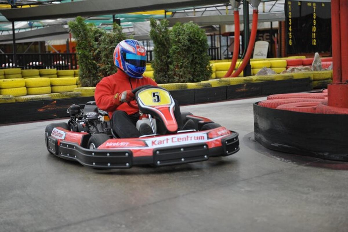 a person riding a toy car on a track
