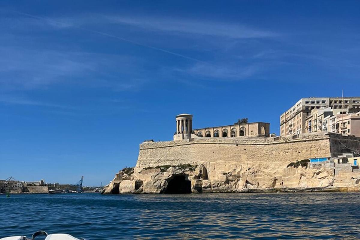 a building on the water next to a body of water
