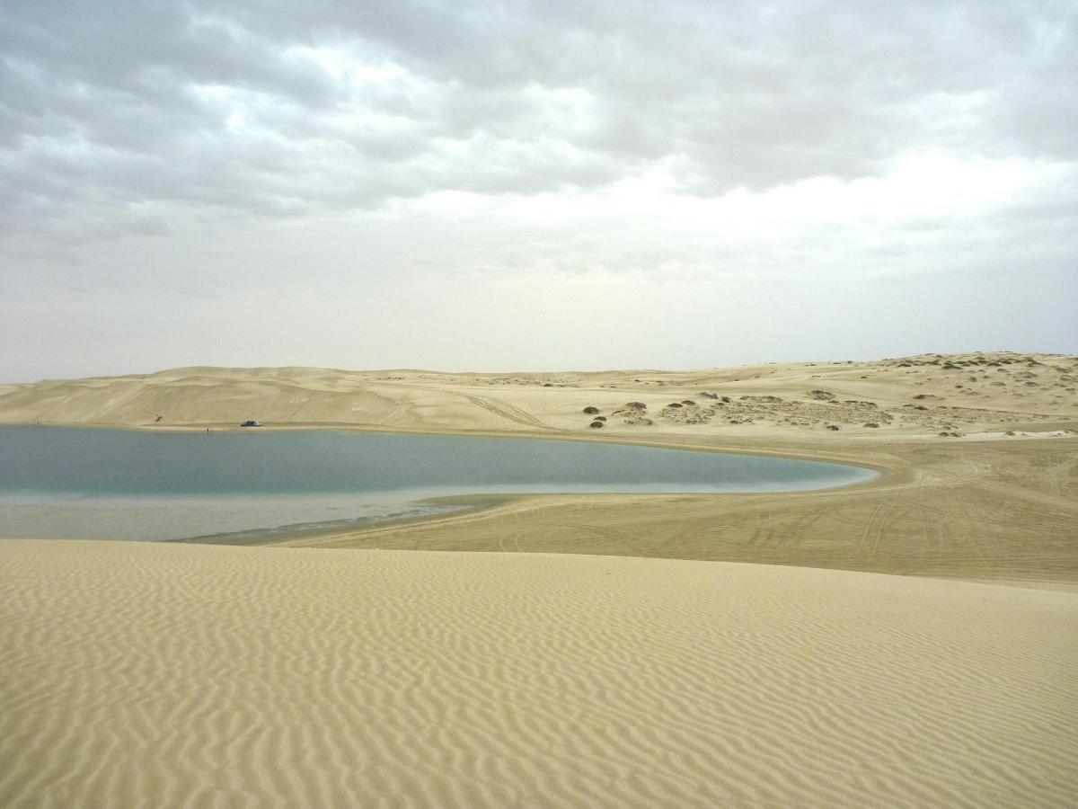 a body of water in the middle of a desert