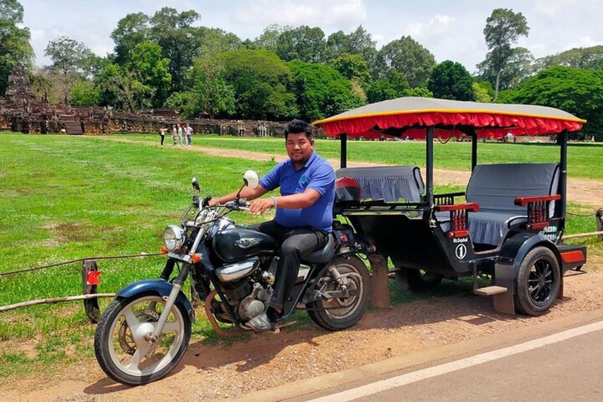 a man sitting on a motorcycle with a golf cart