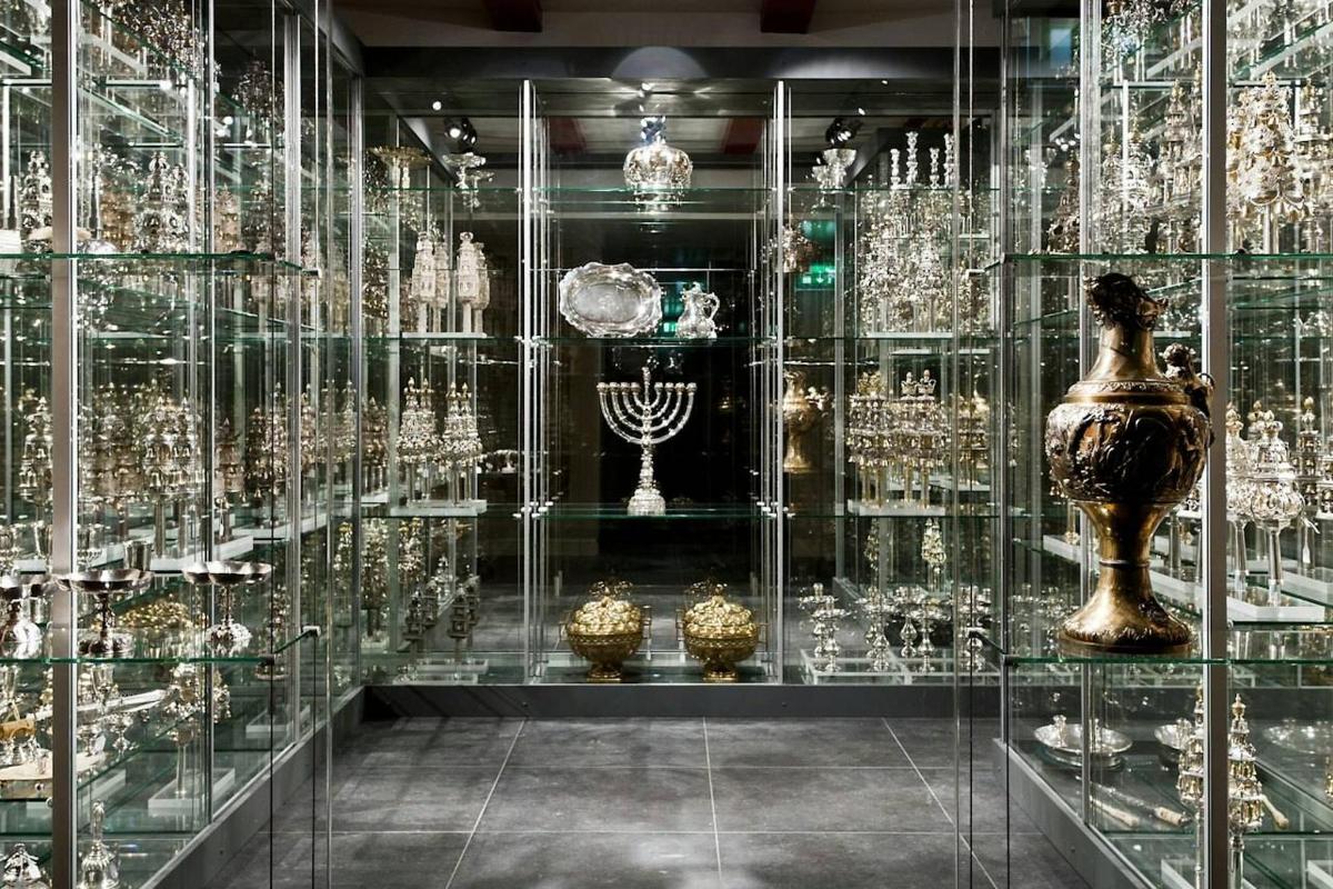 a glass display case filled with lots of glass items