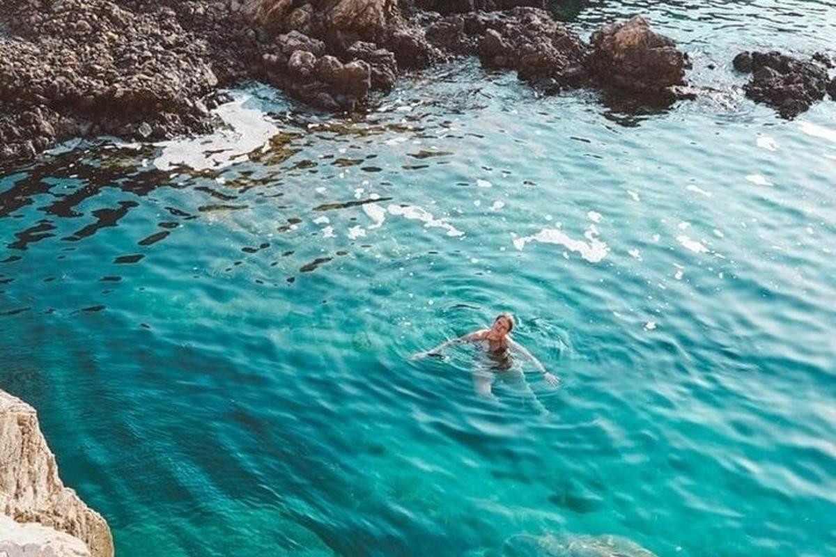 a person swimming in a body of water