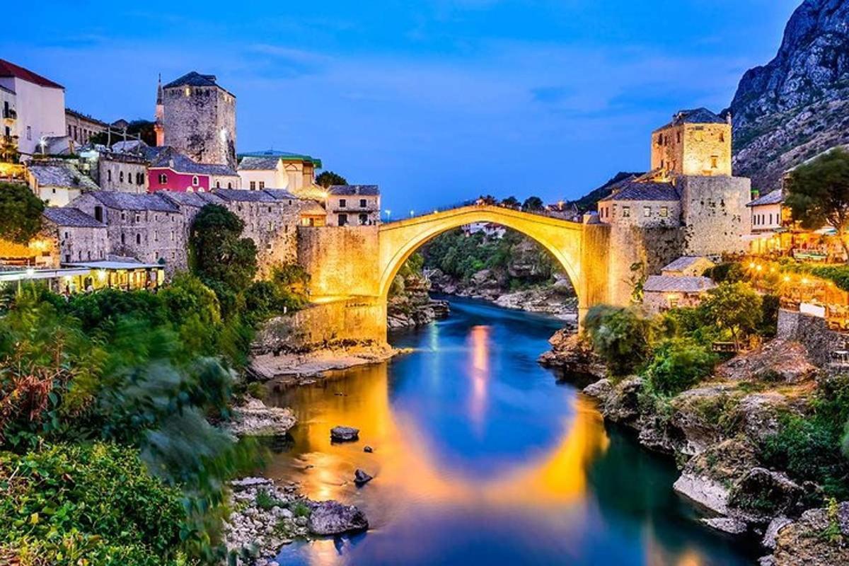 a bridge over a river in front of a city