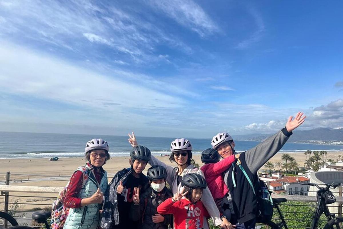 a group of people wearing helmets standing next to the beach