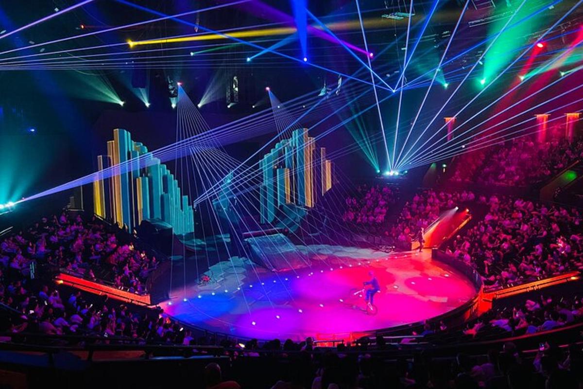 a stage with a crowd of people in a concert