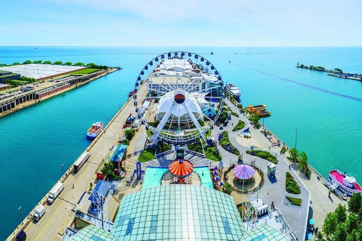 an amusement park with a ferris wheel in the water