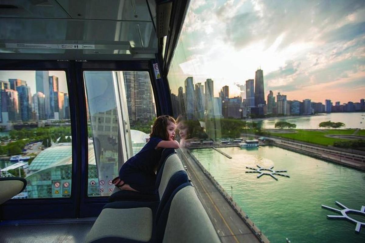 a woman and a child on a train looking at the city