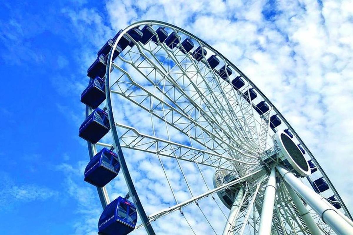 a large ferris wheel against a blue sky