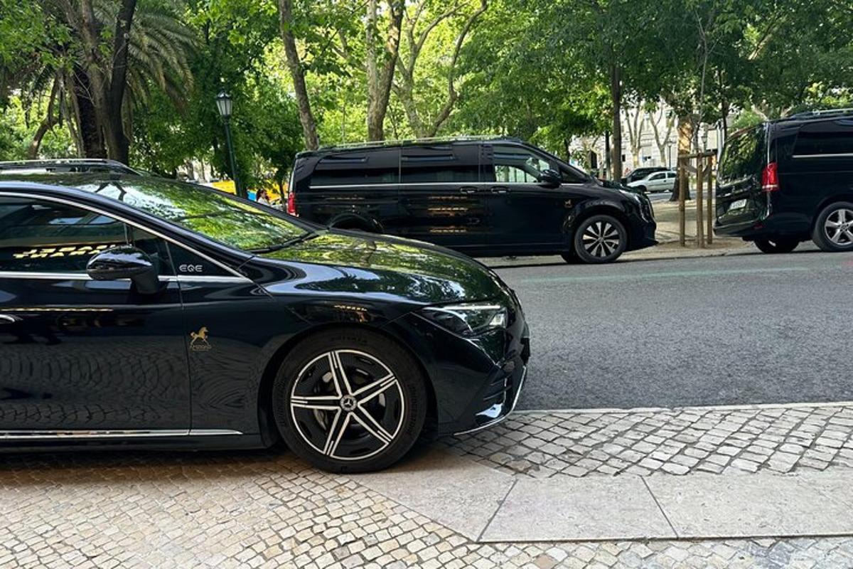 a black car parked on the side of a street