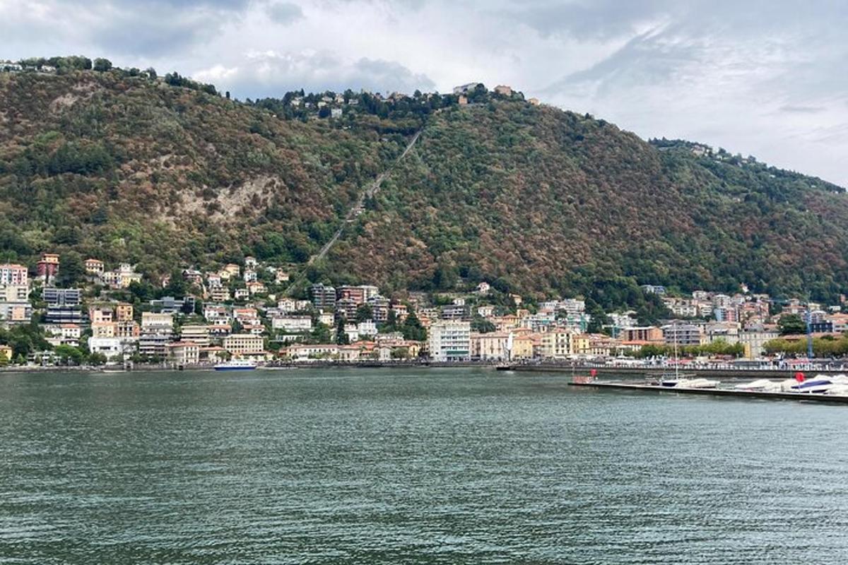 a large body of water in front of a mountain