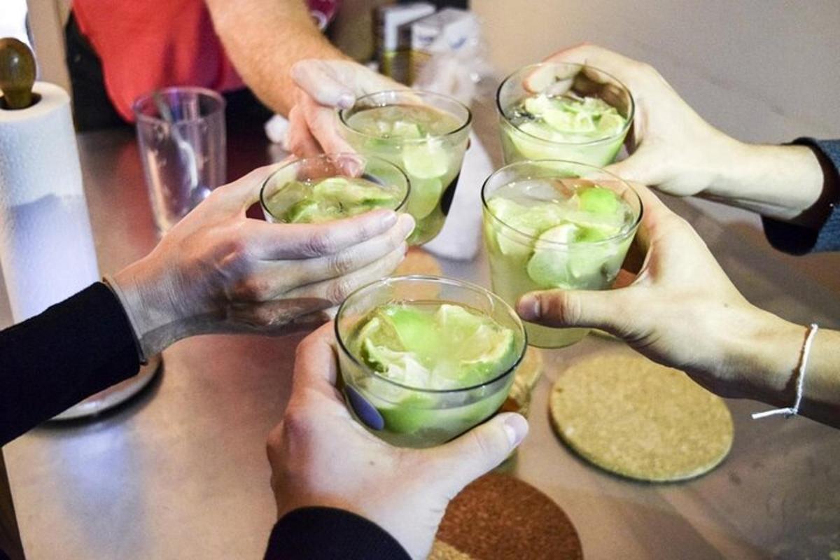 a group of people holding up glasses of drinks