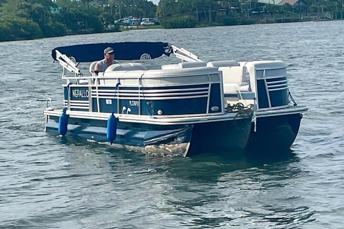 a man sitting on a boat in the water
