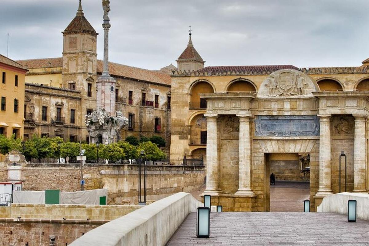 a large building with a bridge in front of it