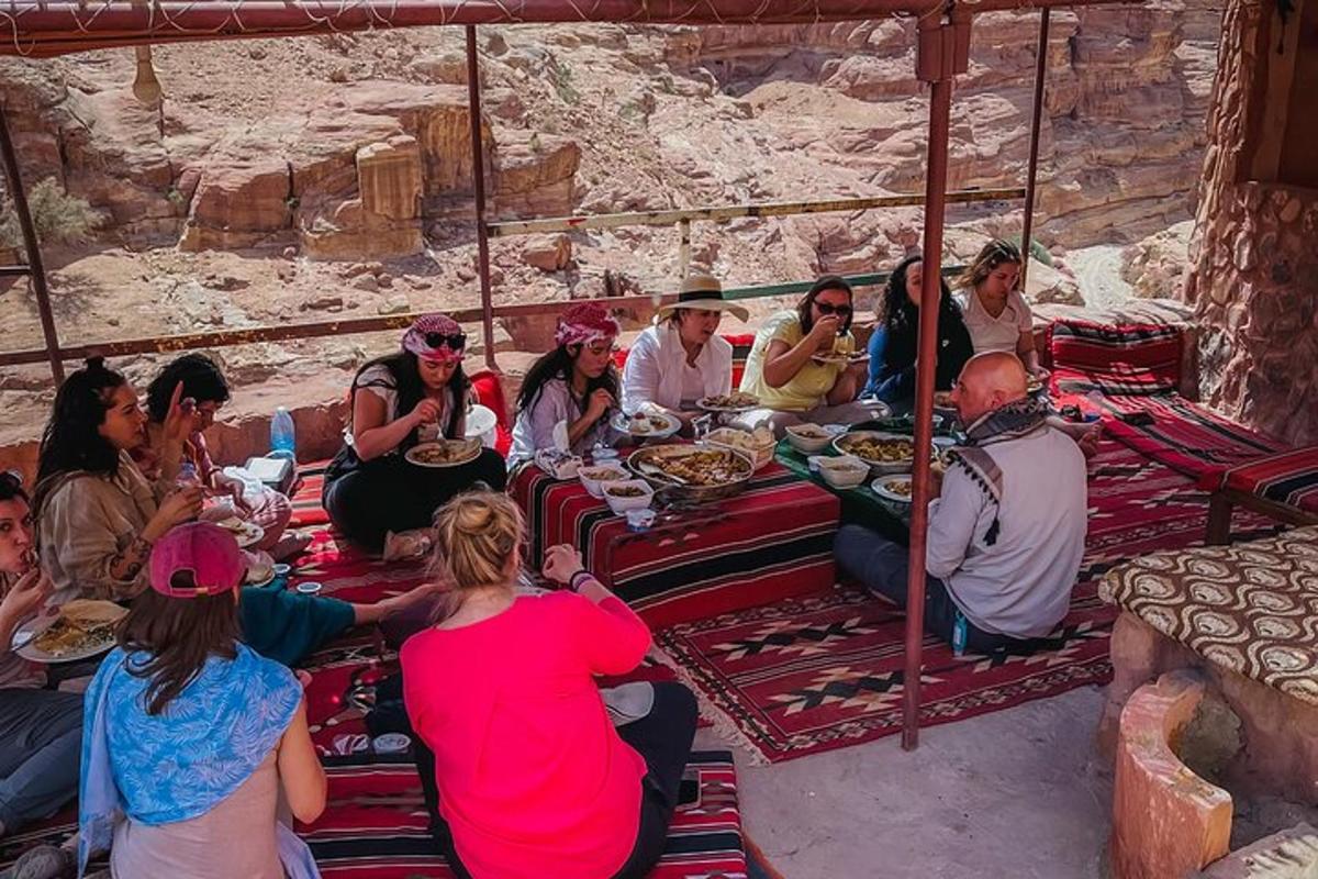 a group of people sitting around a table eating food