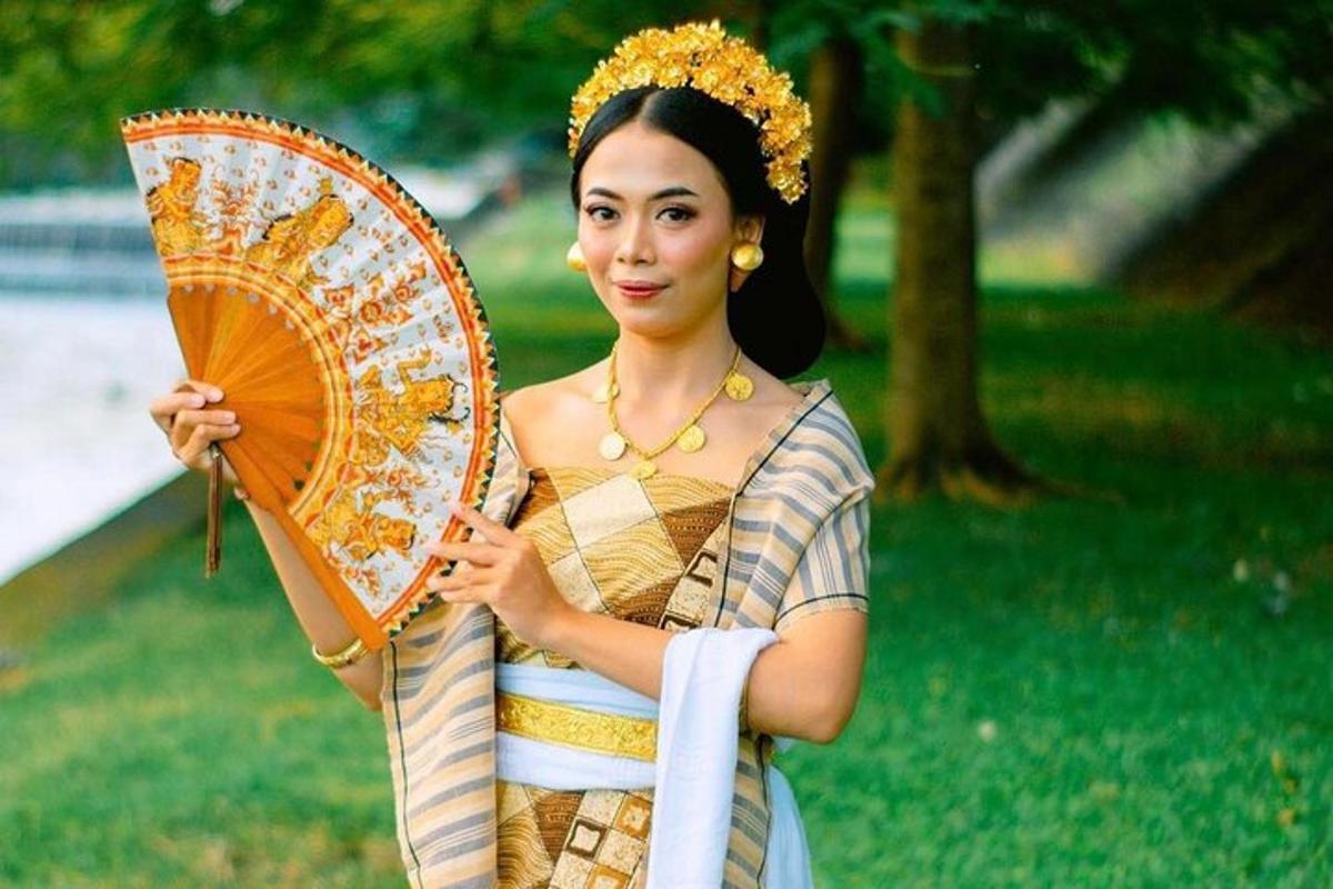 a woman in a dress holding an umbrella