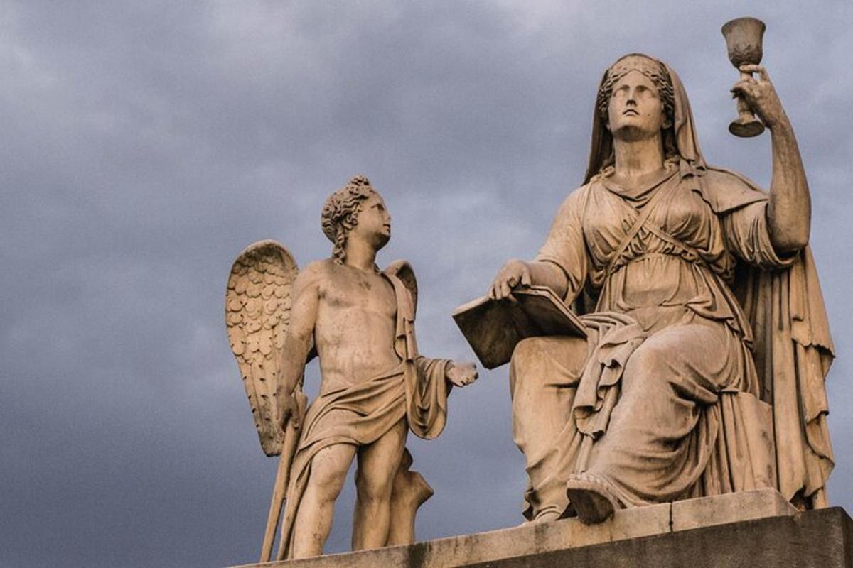 a statue of an angel and a child on a building