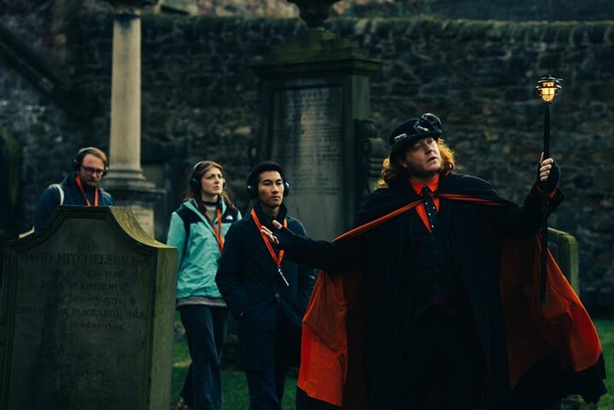 a group of people standing in front of a grave