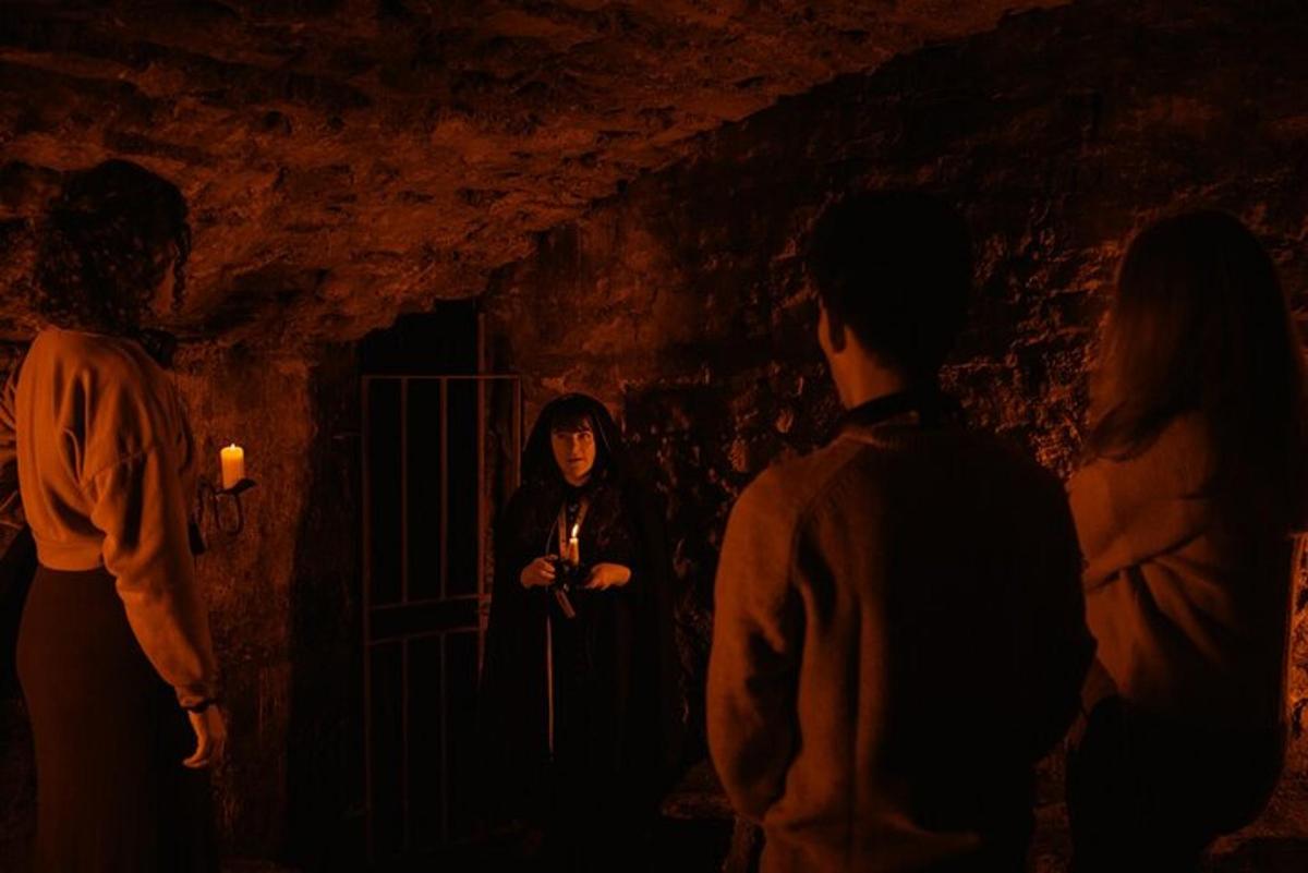 a group of people standing in a dark room