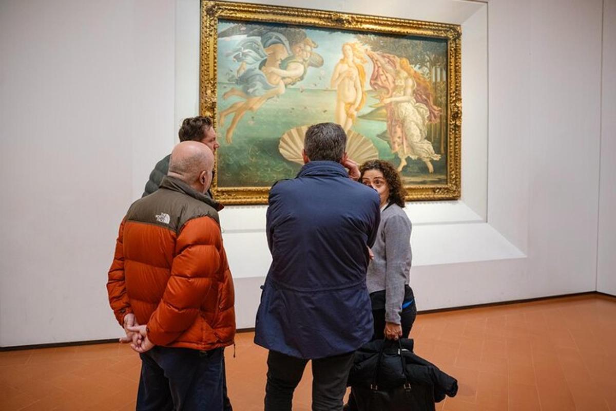 a group of people looking at a painting in an art museum