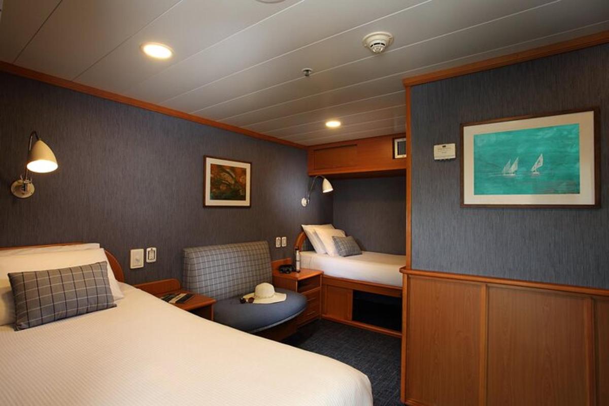 a small room with a bed and a small room with a bed sqor