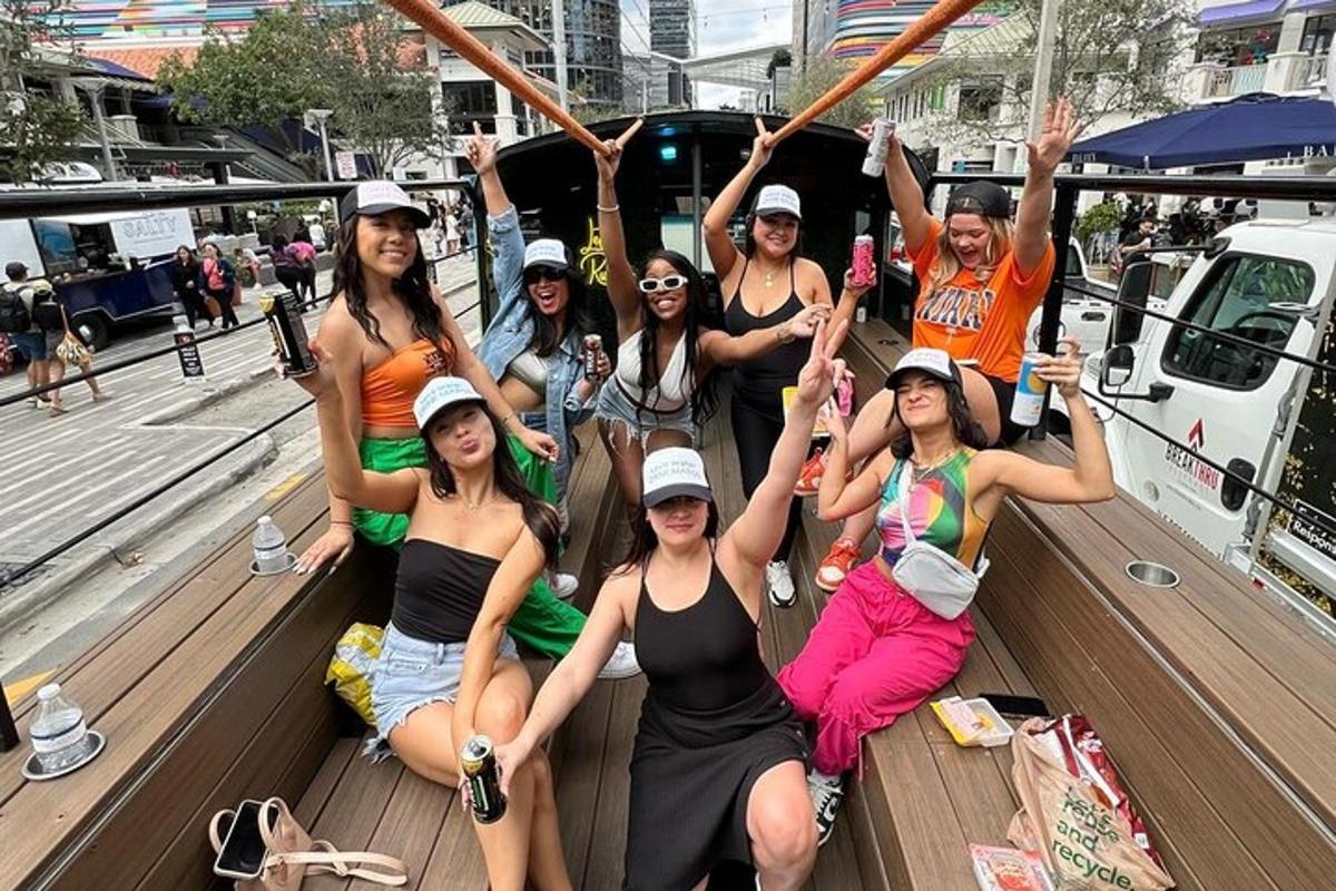a group of women sitting on the back of a boat