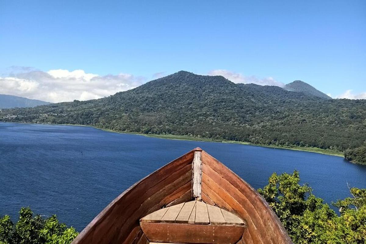 a wooden boat sitting on top of a lake