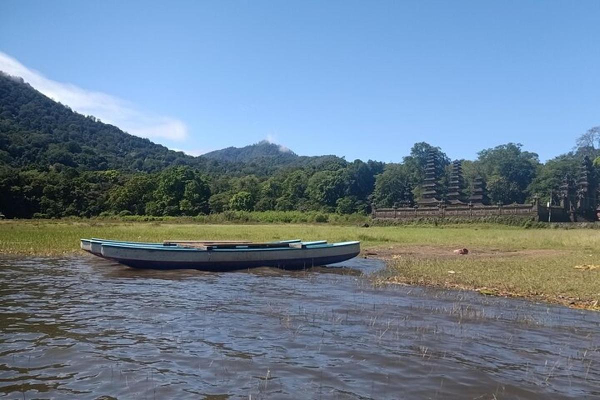 a boat sitting in the middle of a river