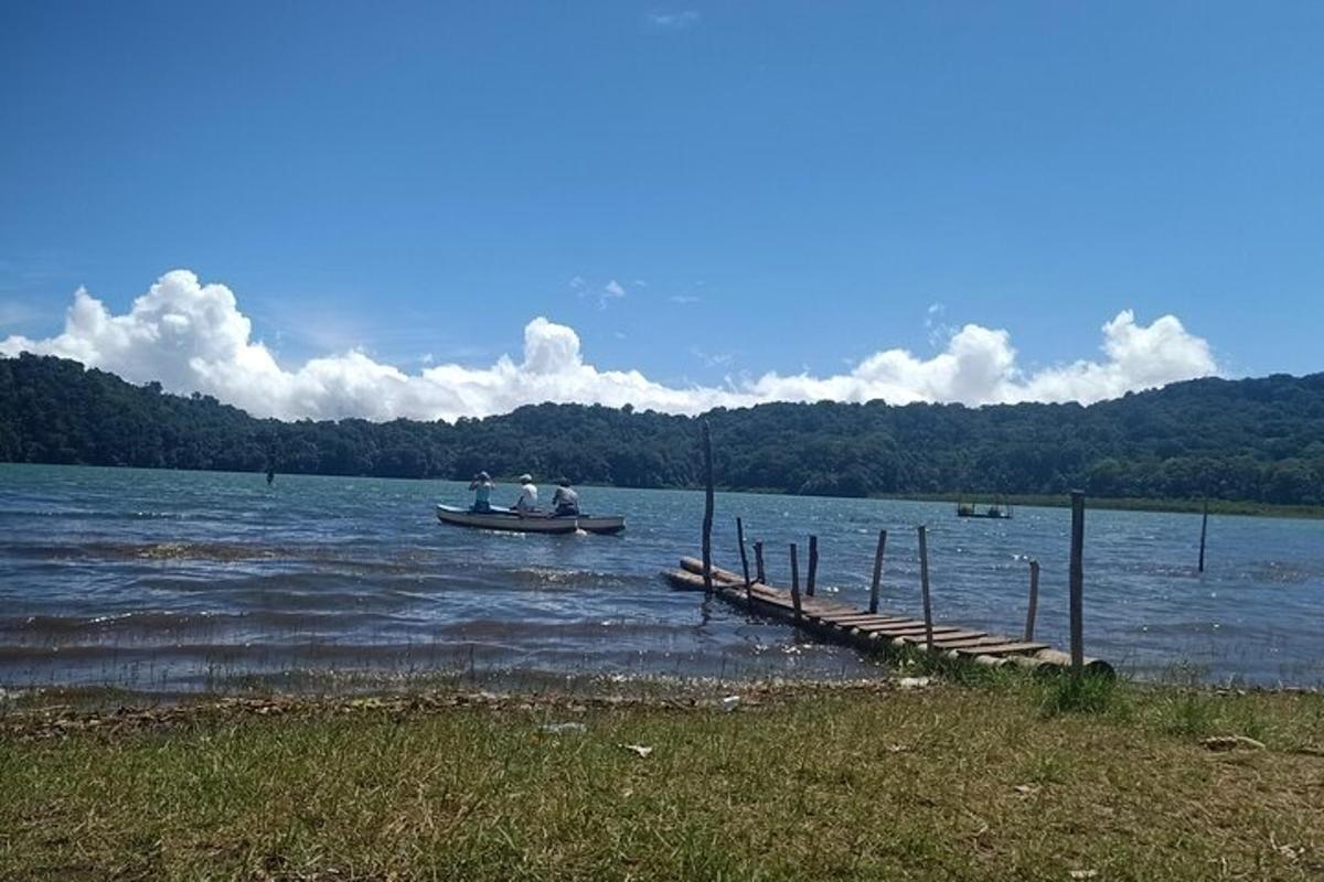 a group of people in a boat on a lake