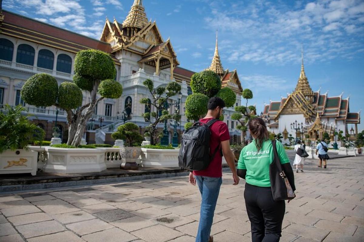 a man and a woman walking in front of a building