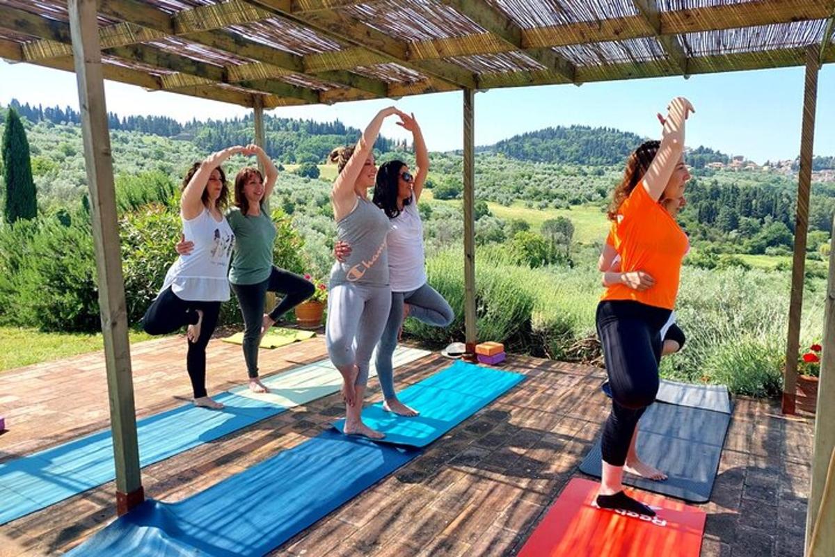 a group of women doing yoga on a yoga deck