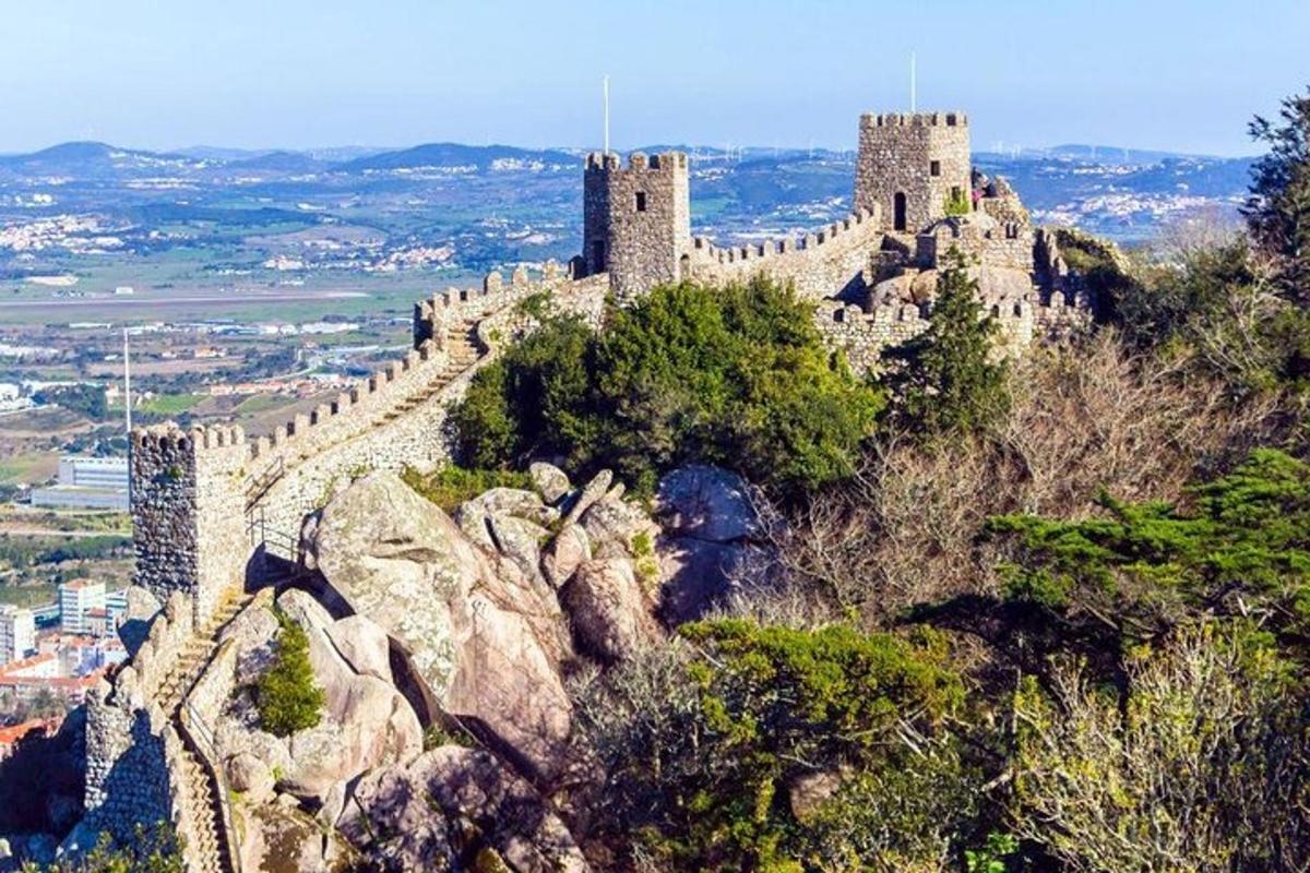 a large castle on top of a mountain