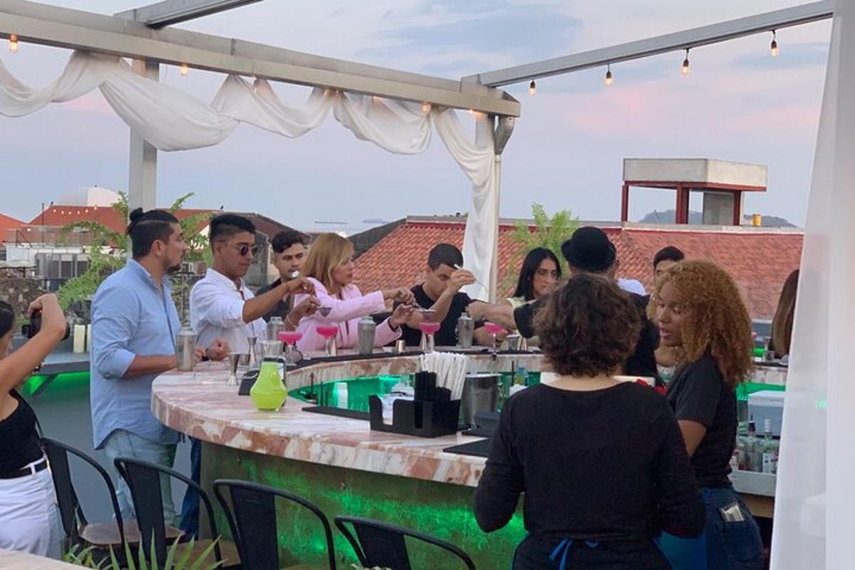 a group of people standing around a bar