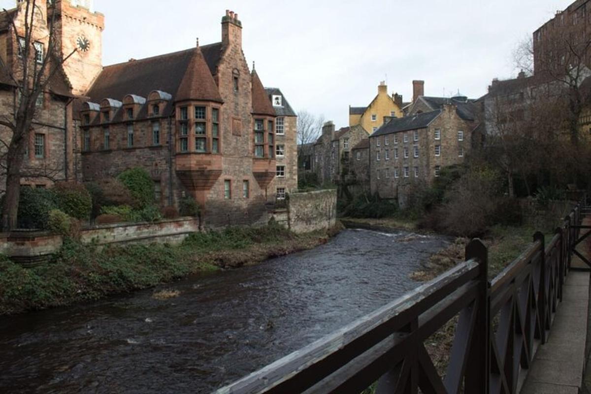 a bridge over a river in a city with buildings
