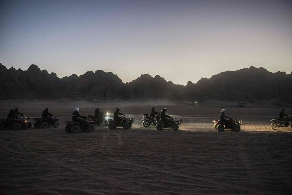 a group of people riding motorcycles in the desert