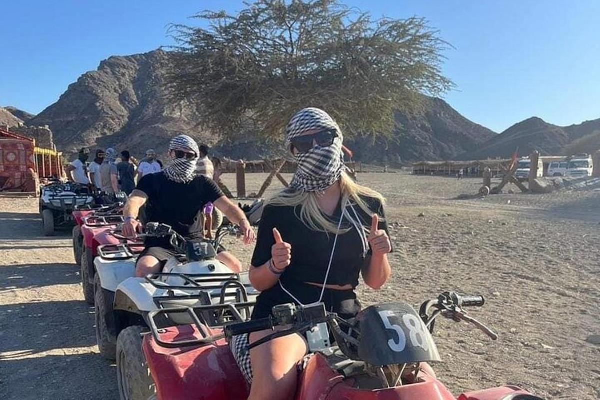 a group of people riding on motorcycles in the desert