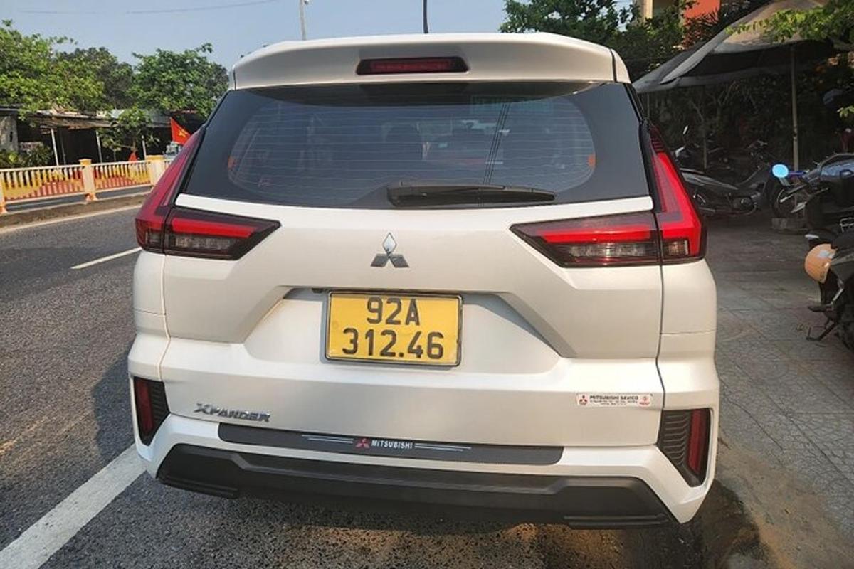 a white car parked on the side of a road