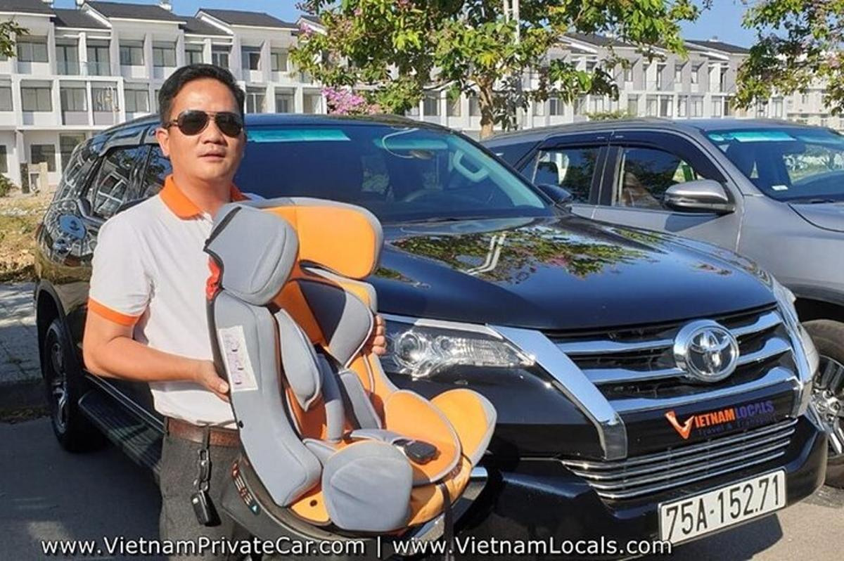 a man is standing in front of a car