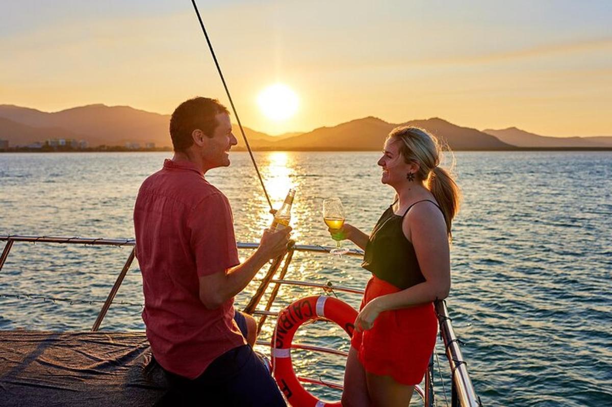 a man and woman on a boat with a glass of wine