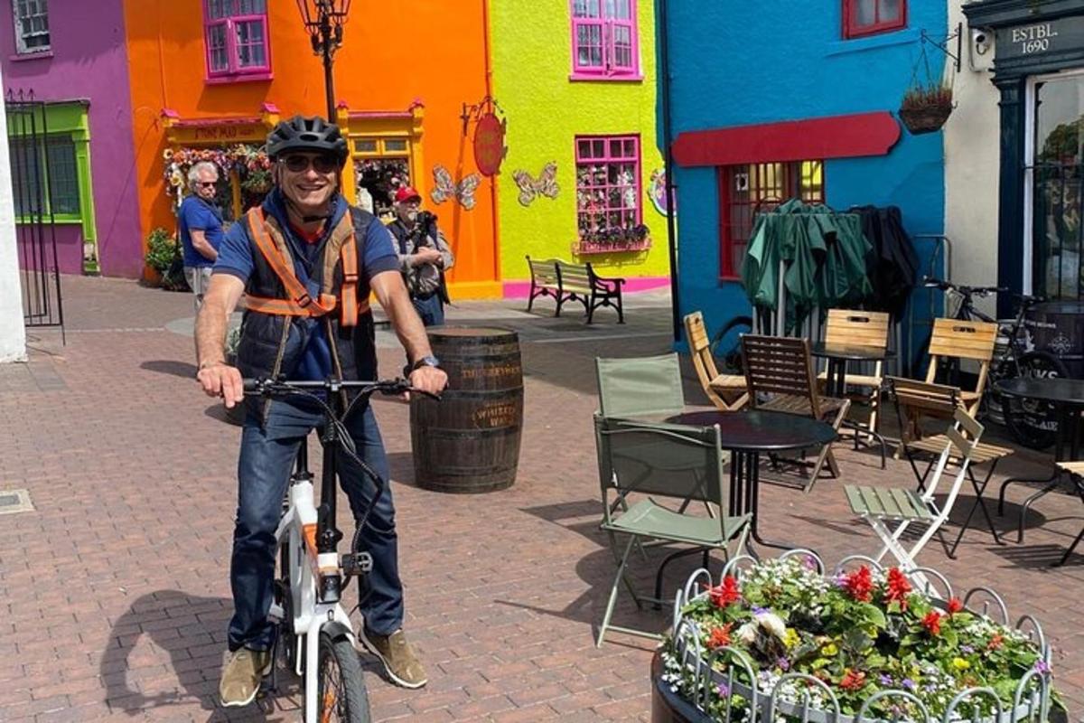 a man riding a bike in front of a building