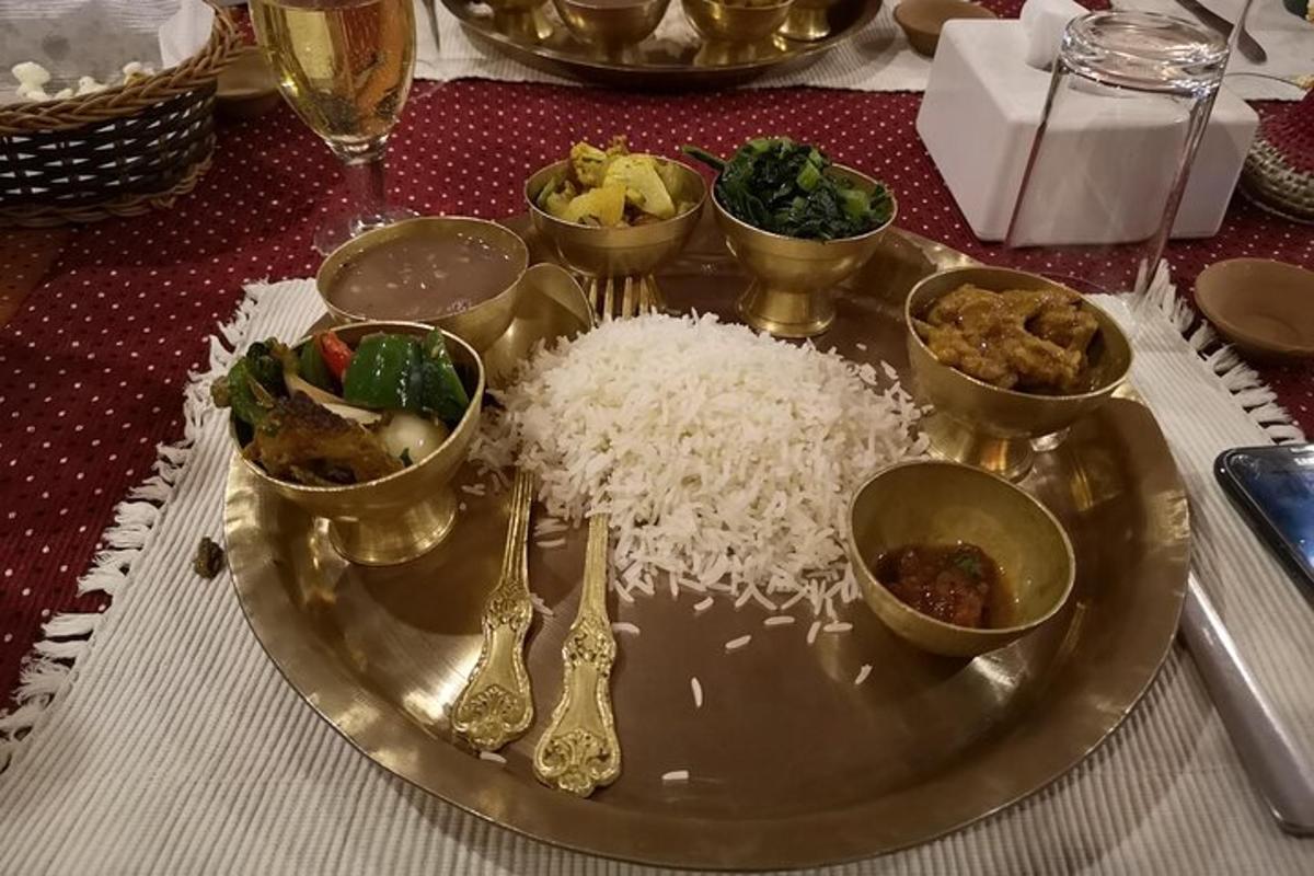 a plate with rice and other food on a table