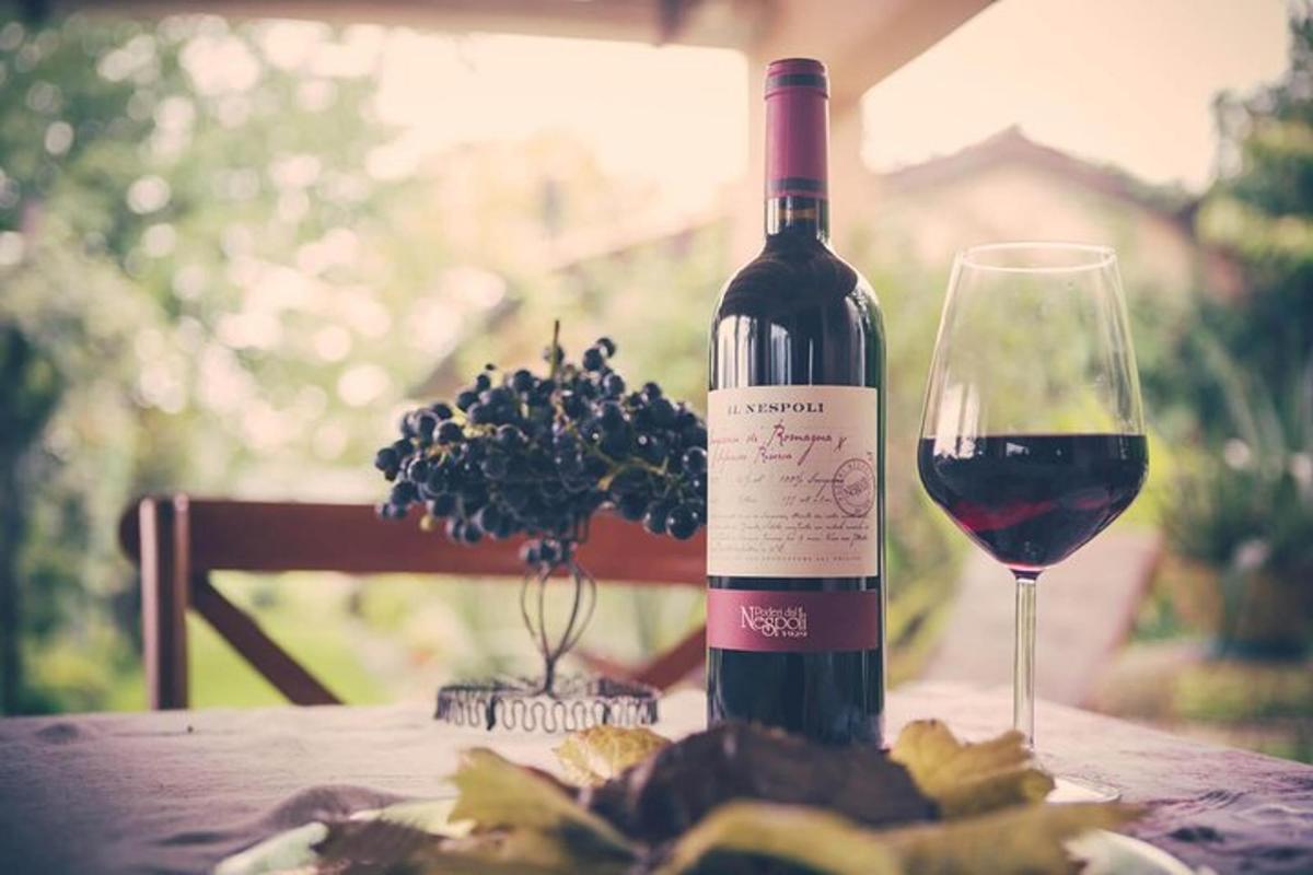 a bottle of wine and a glass on a table