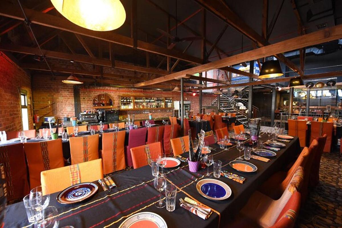a dining room with a long table and chairs