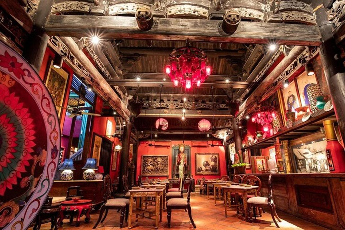 a restaurant with tables and chairs and a chandelier