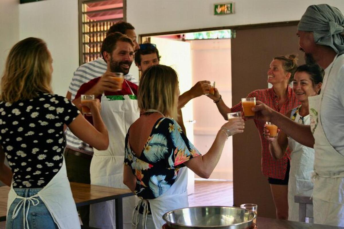 a group of people standing around drinking wine