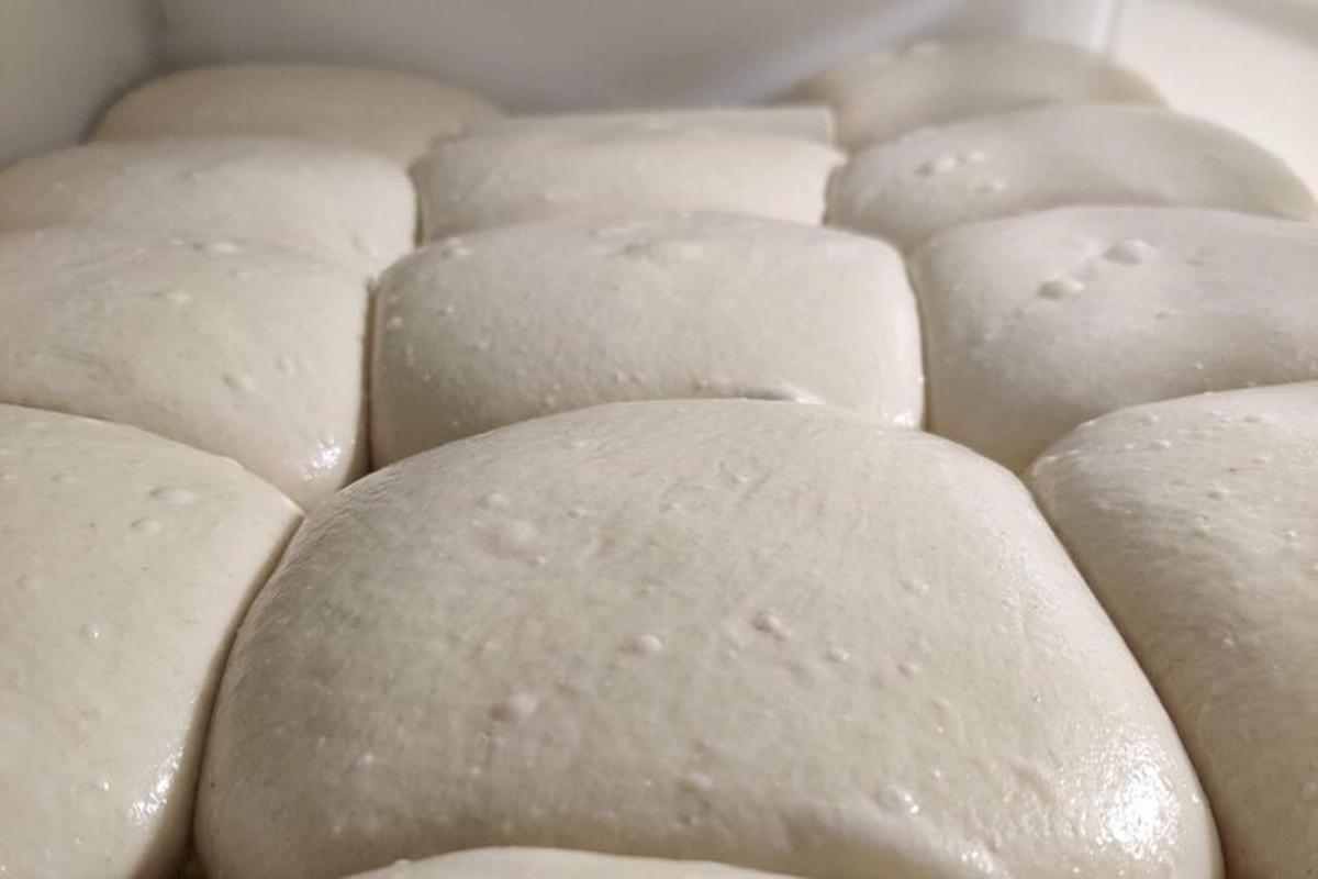a group of white buns are lined up