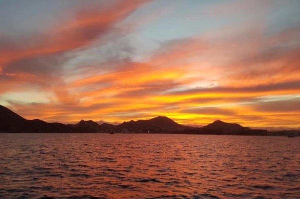 a sunset over a large body of water