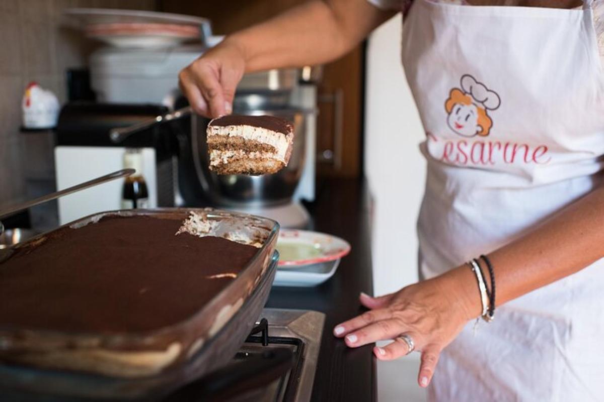 a woman is preparing a chocolate cake in a kitchen