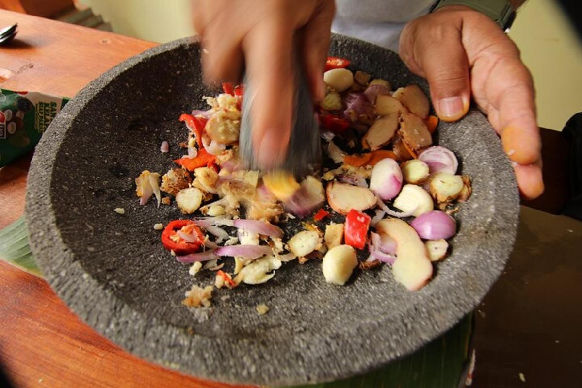 a person cutting up vegetables in a bowl
